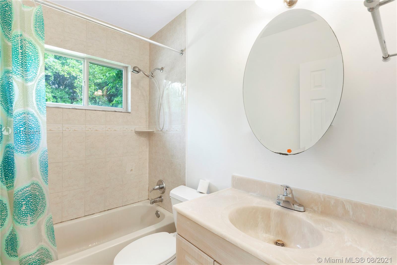 12501 Southwest 84th Avenue Road Miami, FL 33156 - Photo 18 of 20 a bathroom with a sink a toilet and shower