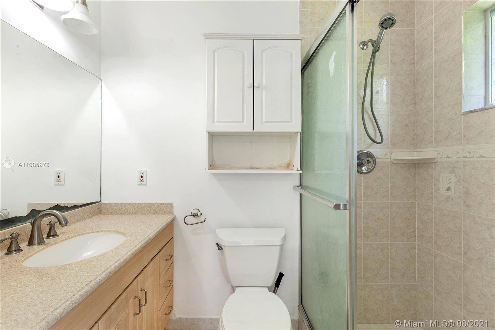 12501 Southwest 84th Avenue Road Miami, FL 33156 - Photo 19 of 20 a bathroom with a sink toilet and shower