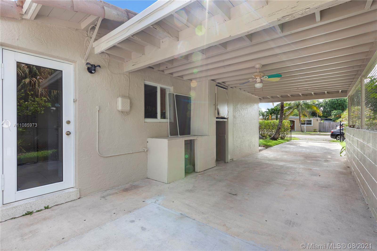 12501 Southwest 84th Avenue Road Miami, FL 33156 - Photo 20 of 20 a view of a patio with table and chairs
