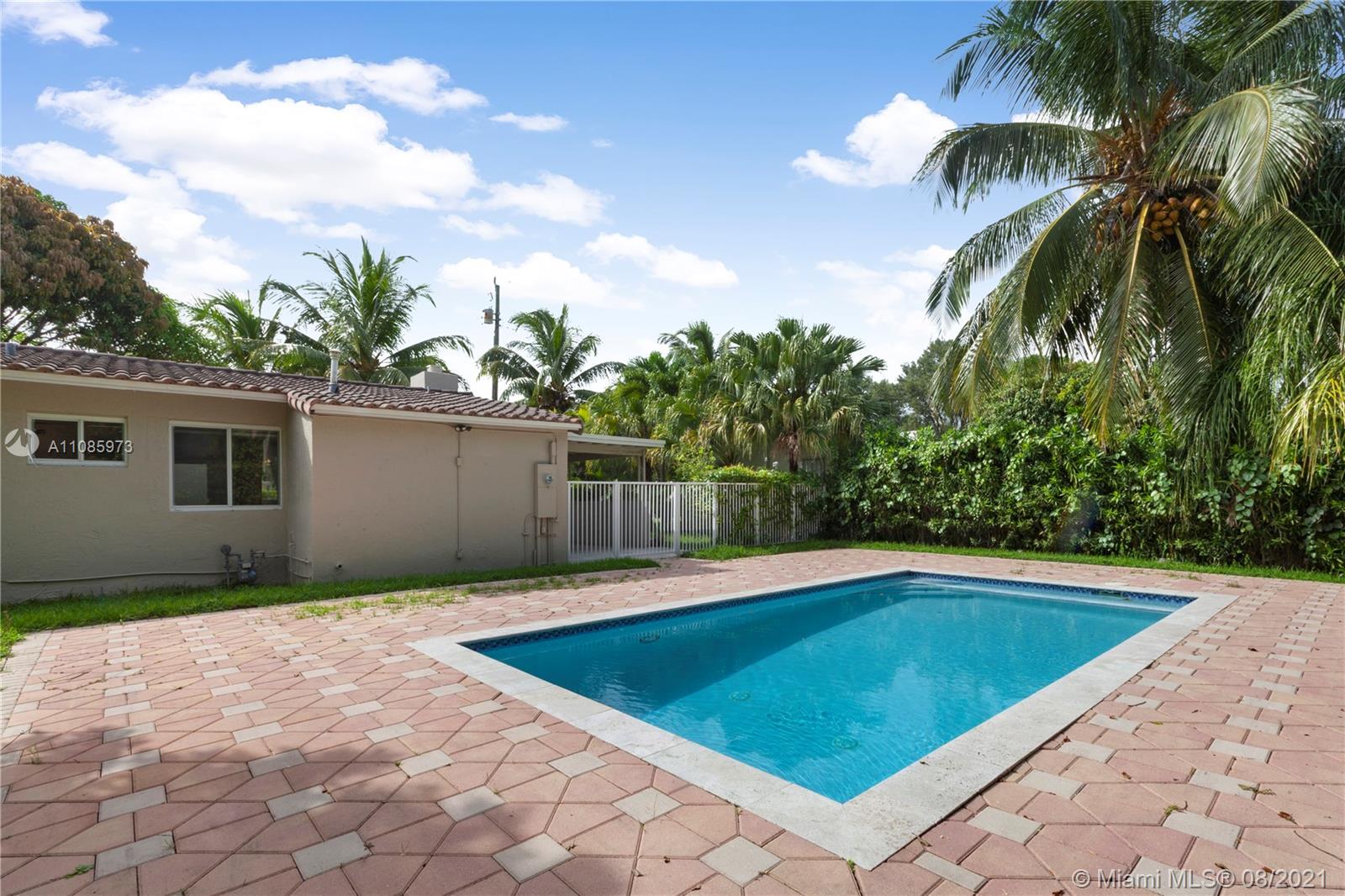 12501 Southwest 84th Avenue Road Miami, FL 33156 - Photo 3 of 20 a view of backyard with swimming pool and outdoor seating