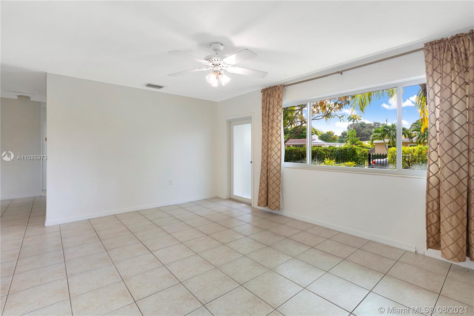 12501 Southwest 84th Avenue Road Miami, FL 33156 - Photo 4 of 20 a view of an empty room with a window