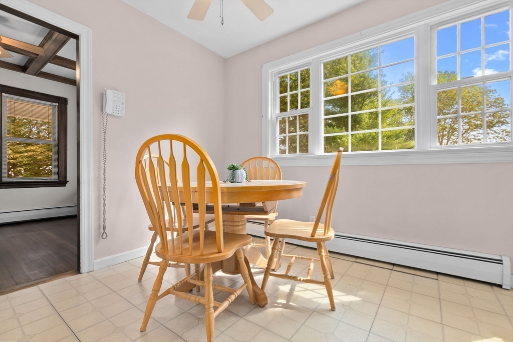 326 William Street Stoneham, MA 02180 - Photo 11 of 39 a view of a dining room with furniture and a window