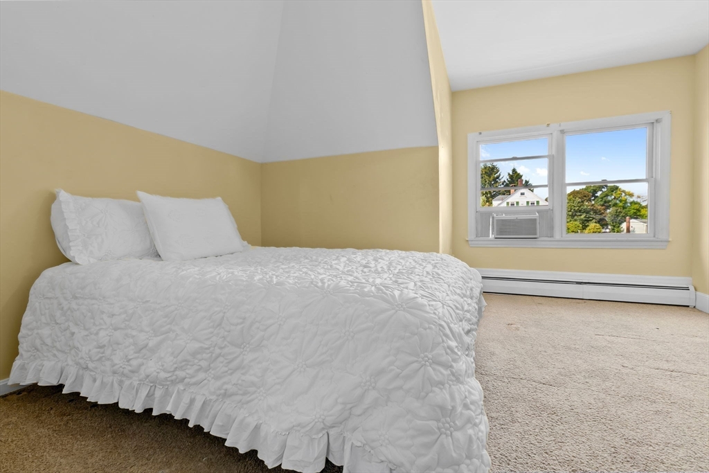 326 William Street Stoneham, MA 02180 - Photo 21 of 39 a bedroom with a bed and window