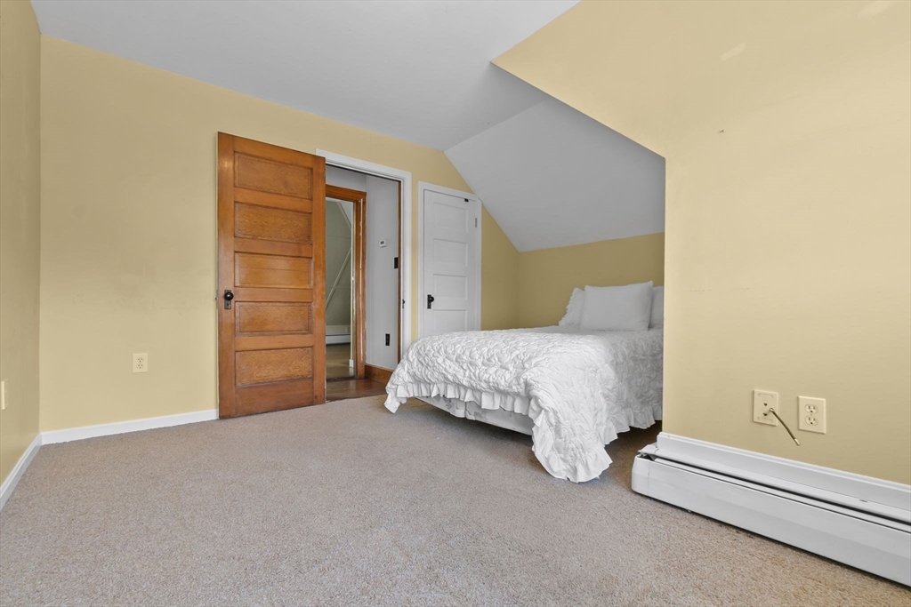 326 William Street Stoneham, MA 02180 - Photo 22 of 39 a bedroom with a bed and a cabinets