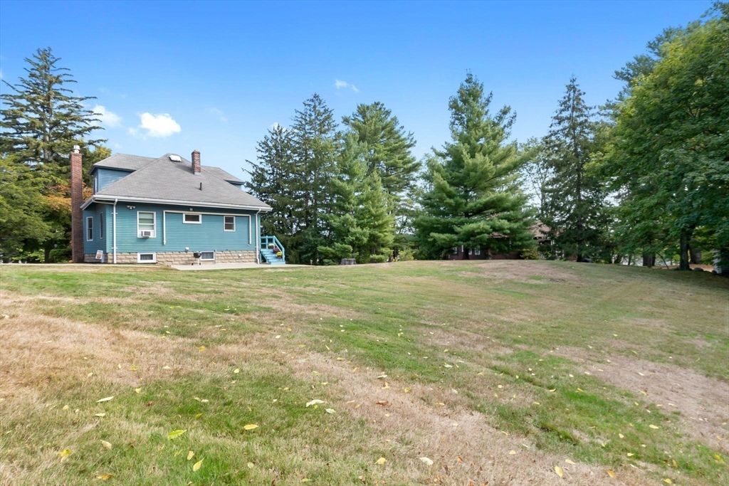 326 William Street Stoneham, MA 02180 - Photo 32 of 39 a front view of a house with a yard