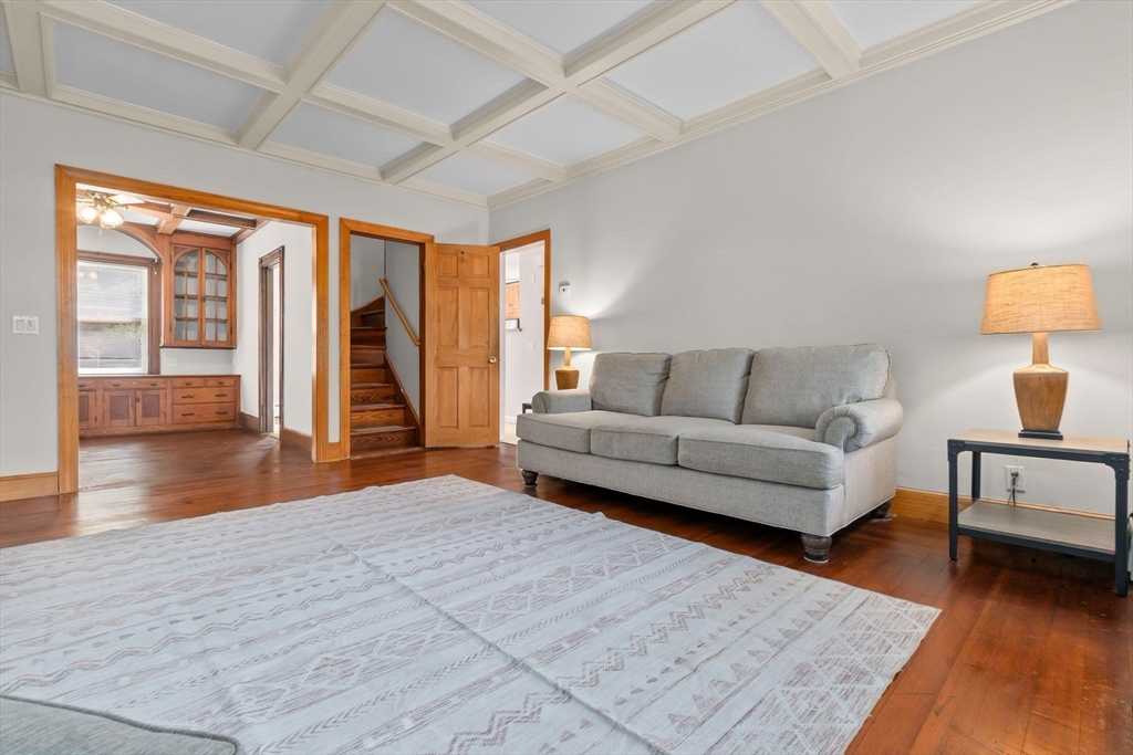 326 William Street Stoneham, MA 02180 - Photo 5 of 39 a living room with furniture and a wooden floor