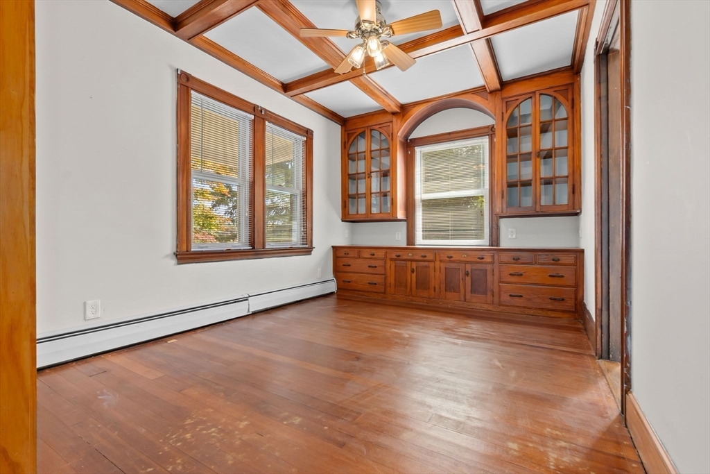 326 William Street Stoneham, MA 02180 - Photo 7 of 39 an empty room with windows chandelier fan and windows