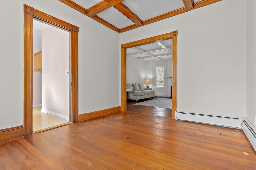 326 William Street Stoneham, MA 02180 - Photo 8 of 39 a view of a room that has a bed wooden floor and a mirror