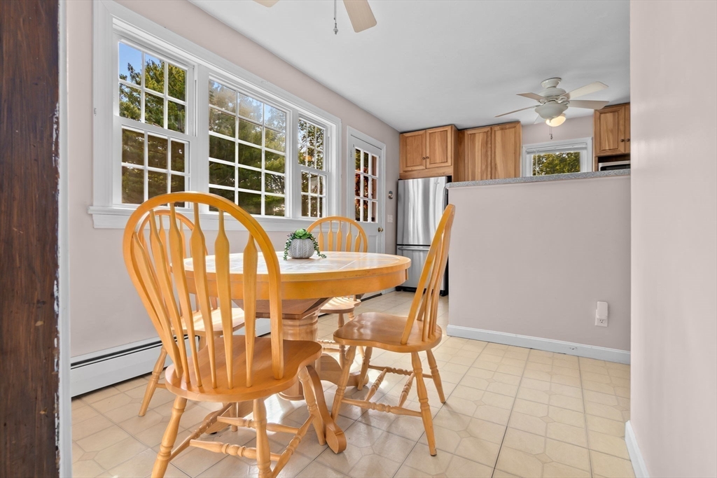 326 William Street Stoneham, MA 02180 - Photo 10 of 39 a view of a dining room with furniture and a window
