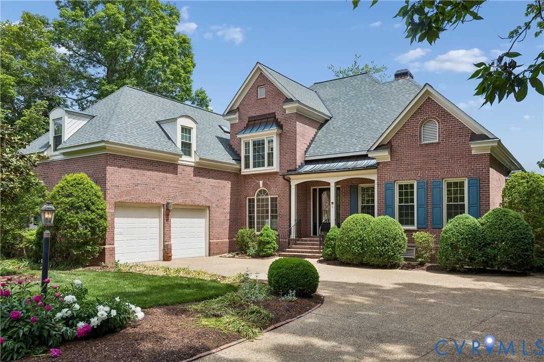 Brick exterior featuring a multi-gabled roof, arch