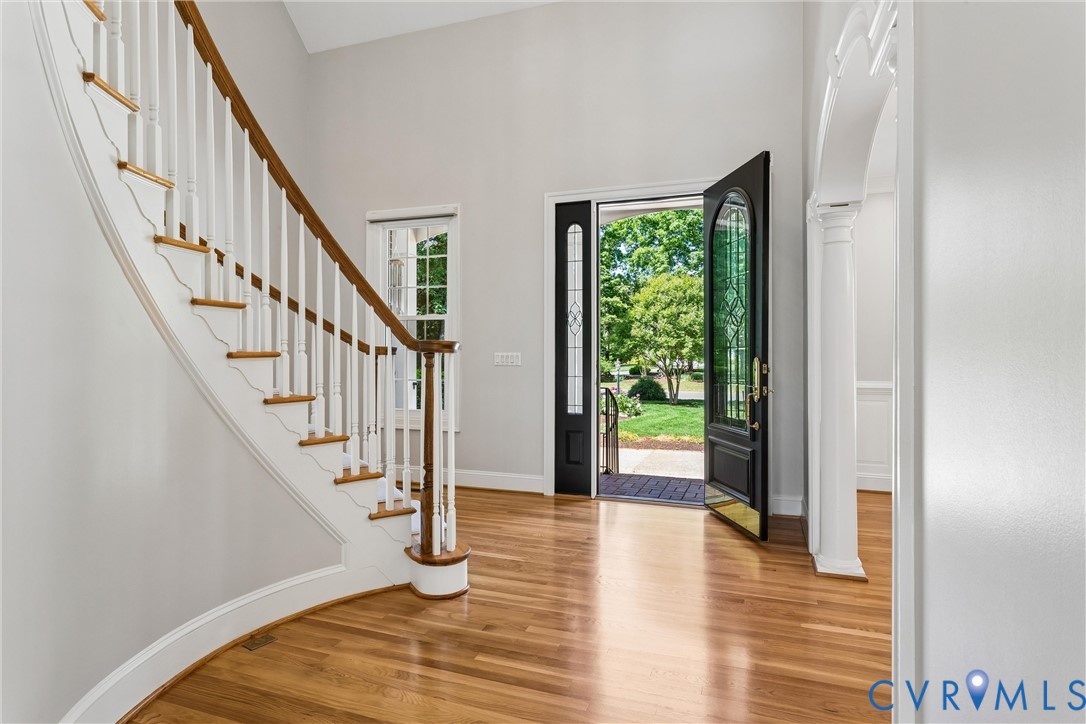 3009 Travis Pond Road Williamsburg, VA 23185 - Photo 11 of 100 Grand entryway featuring wood-finish flooring, a c