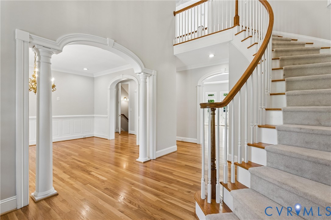 3009 Travis Pond Road Williamsburg, VA 23185 - Photo 12 of 100 Grand entry featuring a curved staircase with wood