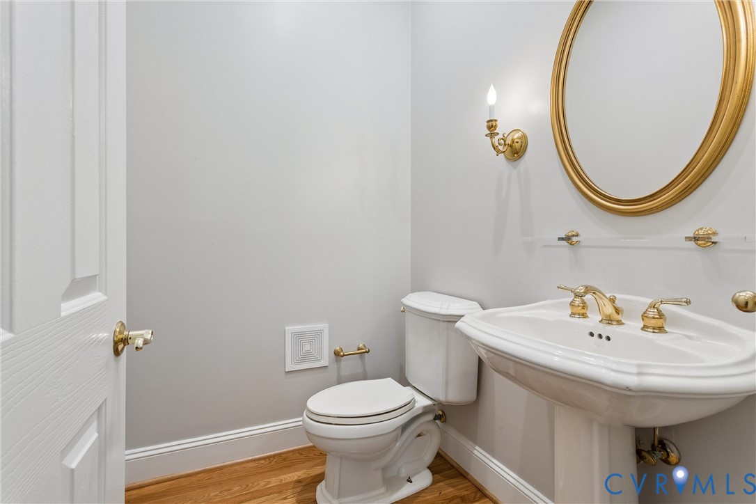 3009 Travis Pond Road Williamsburg, VA 23185 - Photo 13 of 100 Pedestal sink with brass-finish faucet, an oval br