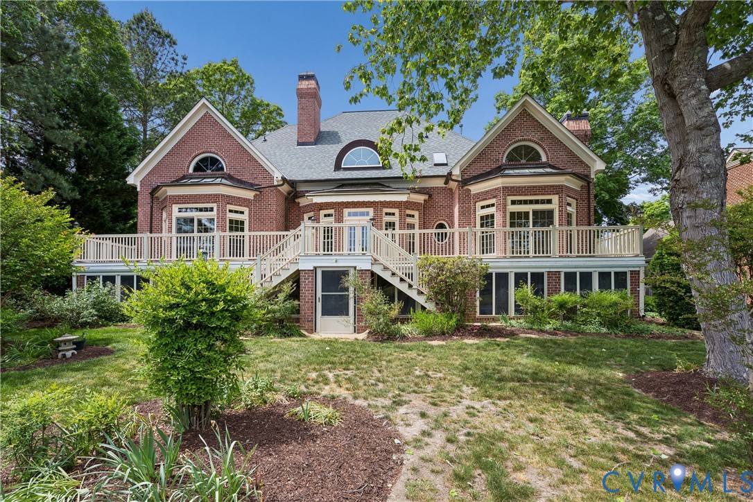 3009 Travis Pond Road Williamsburg, VA 23185 - Photo 2 of 100 Brick exterior featuring a multi-level deck with w