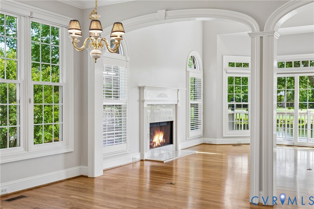 3009 Travis Pond Road Williamsburg, VA 23185 - Photo 30 of 100 Bright interior featuring a white-mantled fireplac