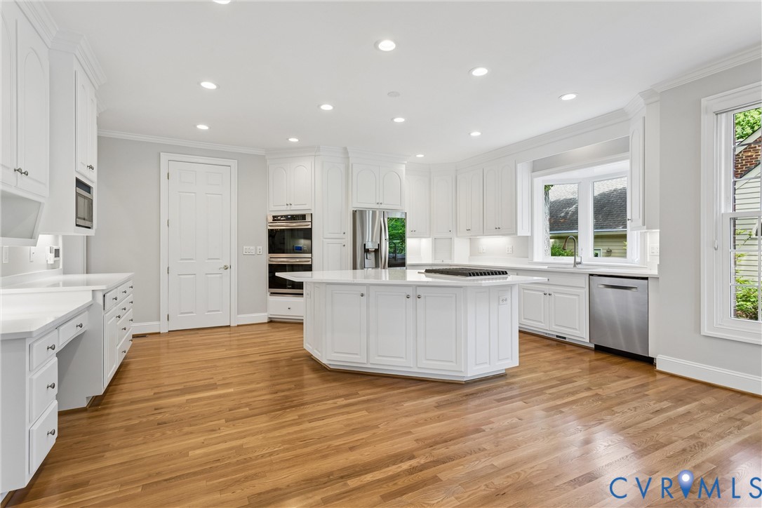 3009 Travis Pond Road Williamsburg, VA 23185 - Photo 32 of 100 Kitchen featuring a central island with a cooktop,