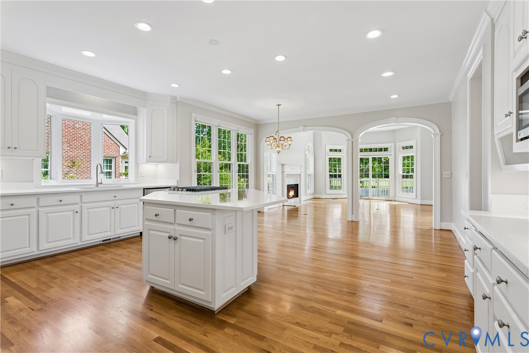 3009 Travis Pond Road Williamsburg, VA 23185 - Photo 37 of 100 Bright kitchen featuring white cabinetry, a centra