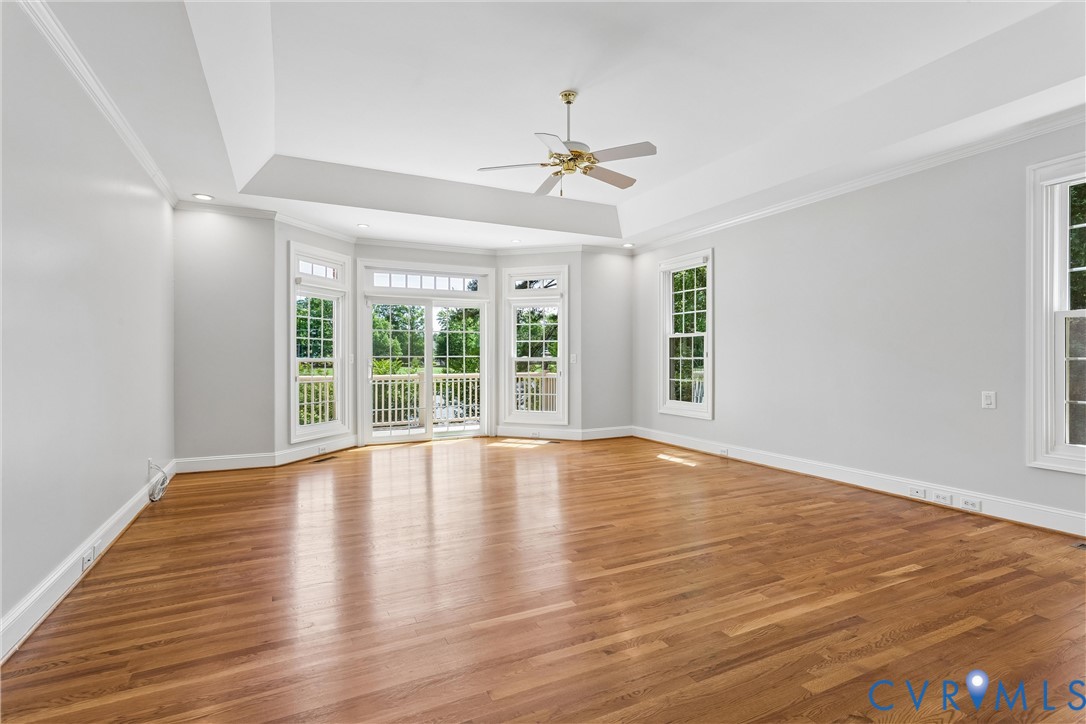 3009 Travis Pond Road Williamsburg, VA 23185 - Photo 41 of 100 Spacious room featuring wood-finish flooring, a tr