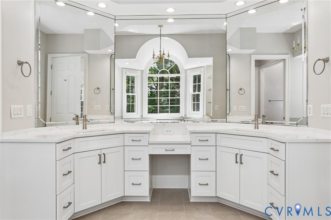 3009 Travis Pond Road Williamsburg, VA 23185 - Photo 47 of 100 Double vanity with white cabinetry and light-toned