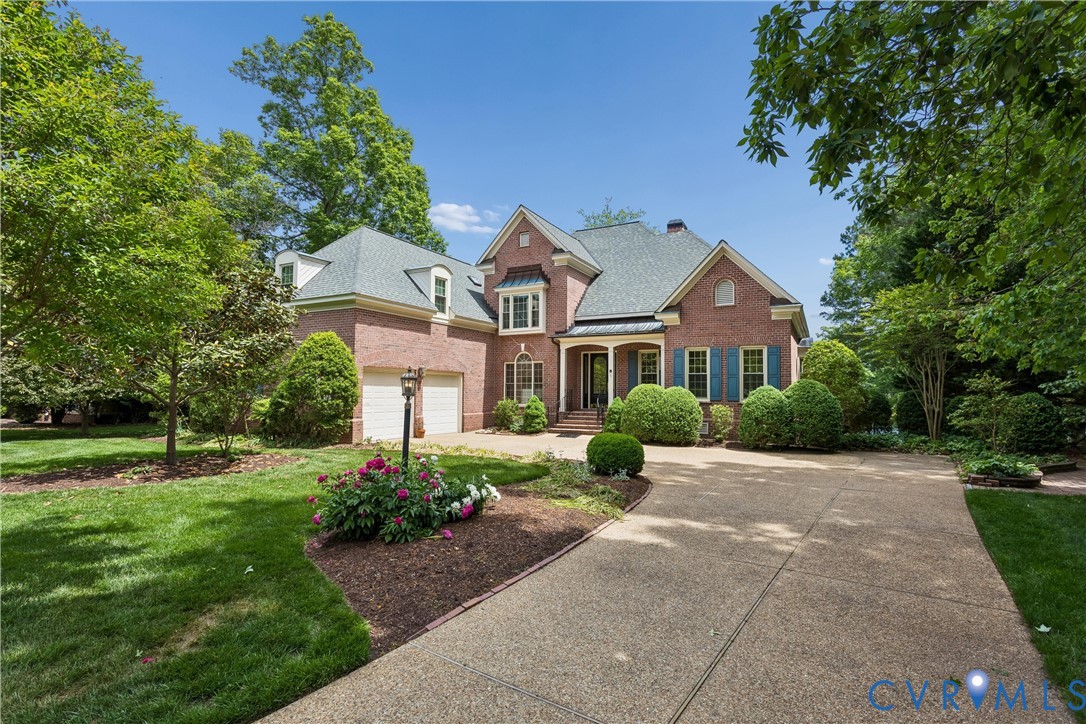 3009 Travis Pond Road Williamsburg, VA 23185 - Photo 5 of 100 Brick two-story residence with a multi-car garage,