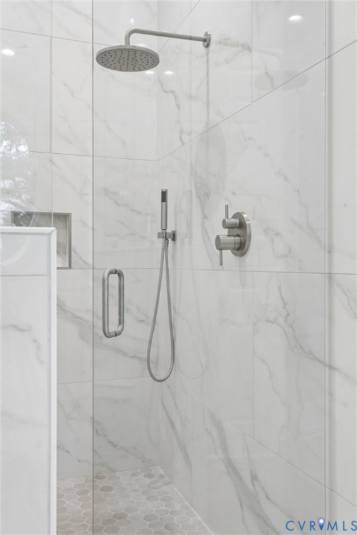 3009 Travis Pond Road Williamsburg, VA 23185 - Photo 51 of 100 Shower with white marble-patterned wall tiles, bru