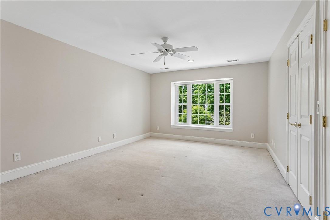 3009 Travis Pond Road Williamsburg, VA 23185 - Photo 55 of 100 Neutral-toned room featuring a large window with m