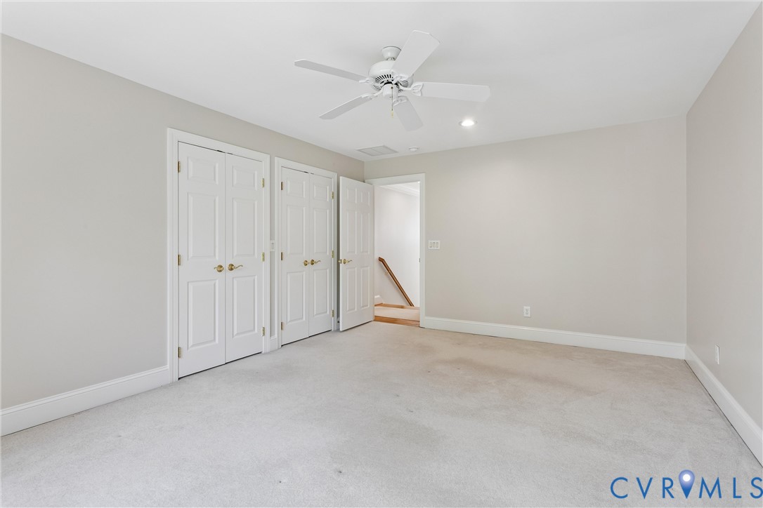 3009 Travis Pond Road Williamsburg, VA 23185 - Photo 56 of 100 Neutral-toned room featuring light-colored carpeti