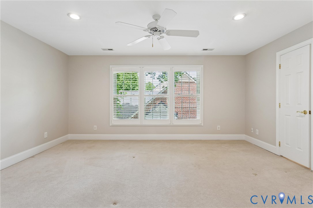 3009 Travis Pond Road Williamsburg, VA 23185 - Photo 57 of 100 Spacious room featuring neutral carpeting and ligh