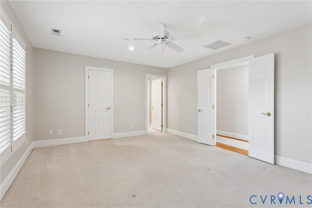 3009 Travis Pond Road Williamsburg, VA 23185 - Photo 58 of 100 Spacious room featuring neutral carpeting and ligh