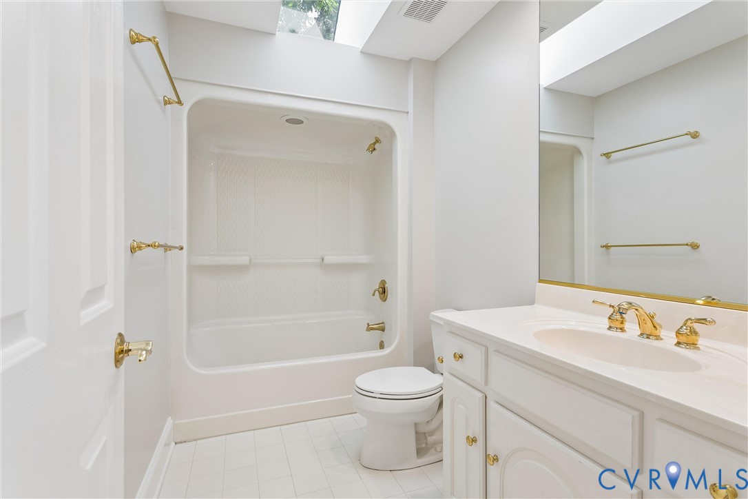 3009 Travis Pond Road Williamsburg, VA 23185 - Photo 65 of 100 Full bathroom featuring a white vanity with integr