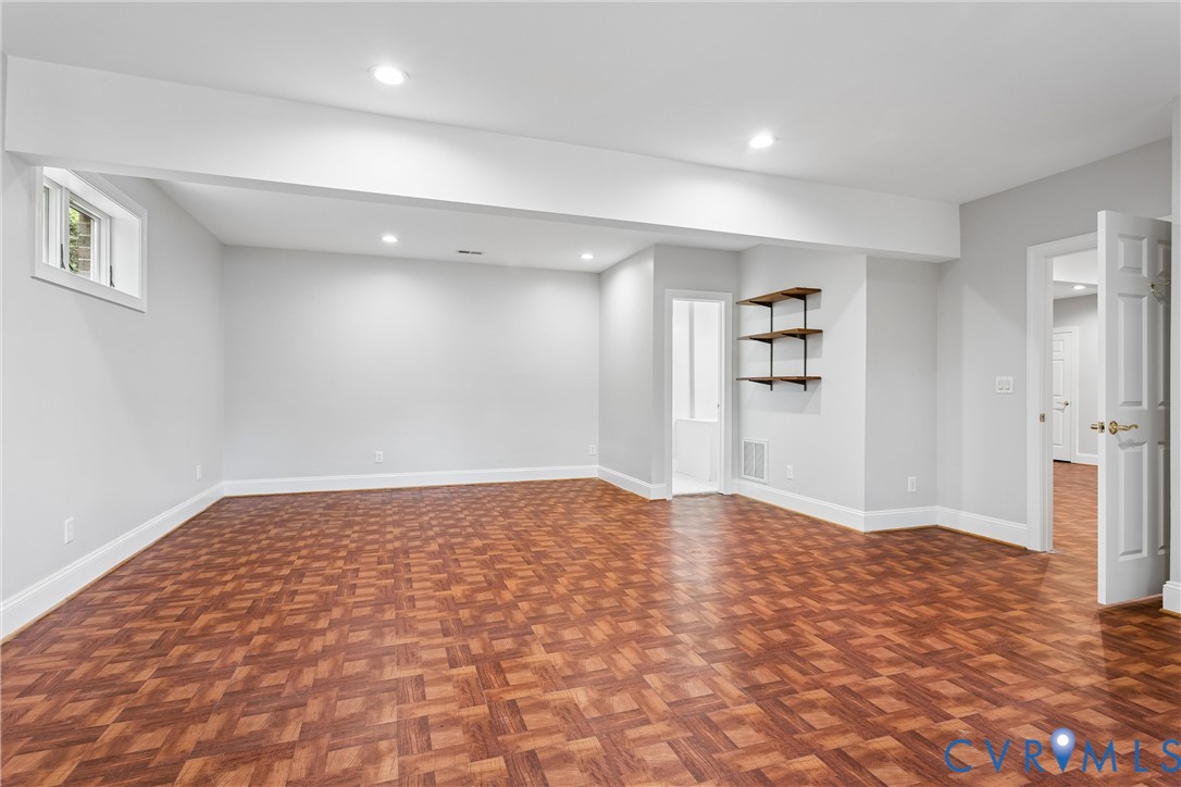 3009 Travis Pond Road Williamsburg, VA 23185 - Photo 70 of 100 Spacious room featuring wood-finish parquet floori