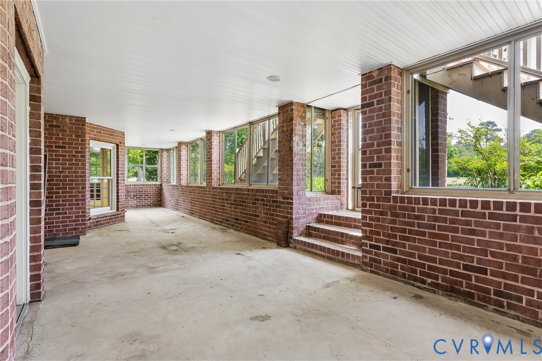3009 Travis Pond Road Williamsburg, VA 23185 - Photo 74 of 100 Covered outdoor space featuring a brick perimeter,