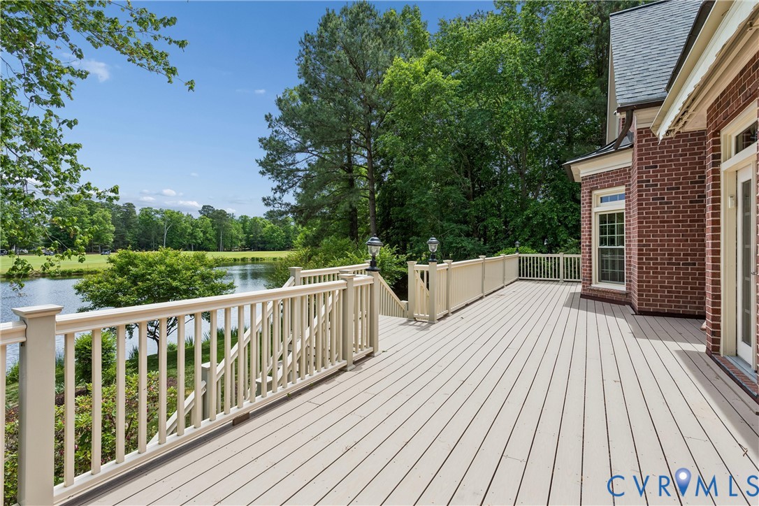 3009 Travis Pond Road Williamsburg, VA 23185 - Photo 75 of 100 Expansive composite deck featuring a painted raili