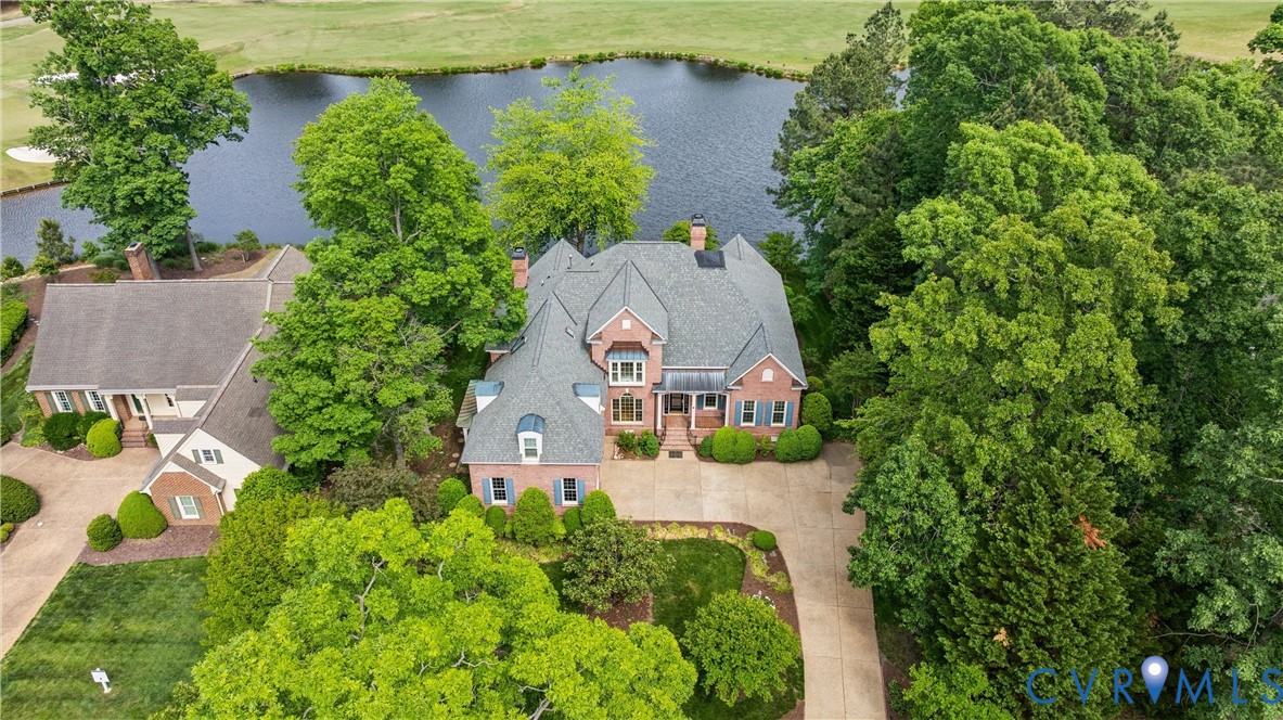 3009 Travis Pond Road Williamsburg, VA 23185 - Photo 80 of 100 Brick residence with a multi-gabled roofline and a
