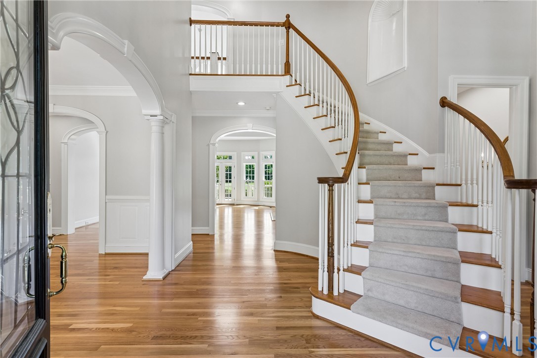 3009 Travis Pond Road Williamsburg, VA 23185 - Photo 9 of 100 Grand entry foyer featuring a sweeping curved stai