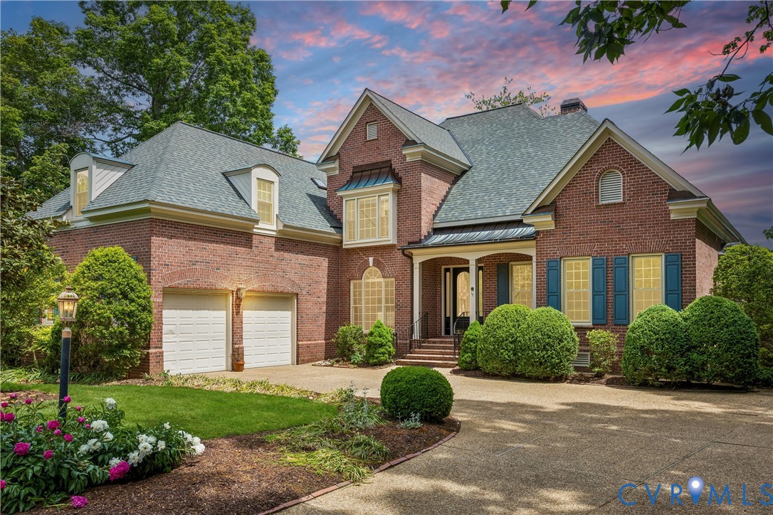 3009 Travis Pond Road Williamsburg, VA 23185 - Photo 91 of 100 Brick exterior with a multi-level roofline, two-ca