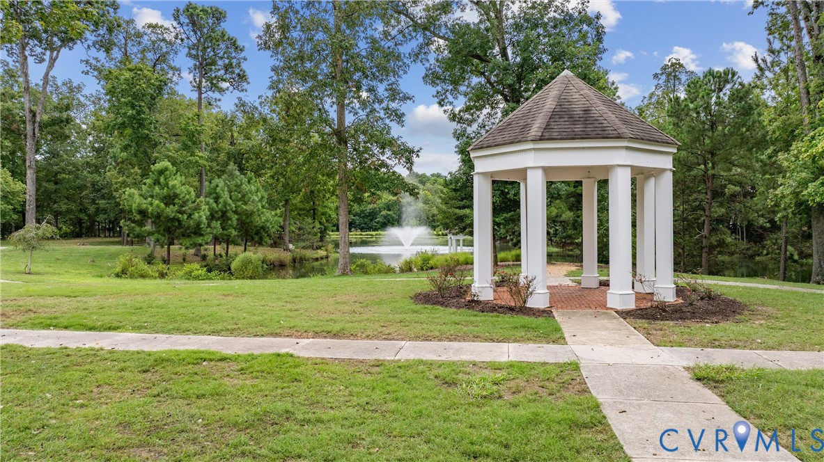 3009 Travis Pond Road Williamsburg, VA 23185 - Photo 95 of 100 White gazebo with a multi-paneled roof, set on a b