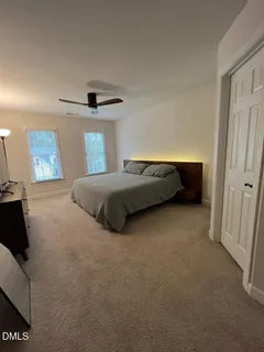 a bedroom with a bed and a walk in closet