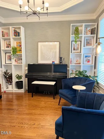 a living room with furniture and a pool table