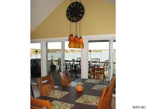 2069 Marquesas Avenue Tega Cay, SC 29708 - Photo 12 of 16 a table room with wooden floor and outdoor view