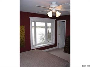 2069 Marquesas Avenue Tega Cay, SC 29708 - Photo 13 of 16 a view of an empty room with window and chandelier fan