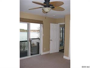 2069 Marquesas Avenue Tega Cay, SC 29708 - Photo 15 of 16 a view of a hallway with a chandelier