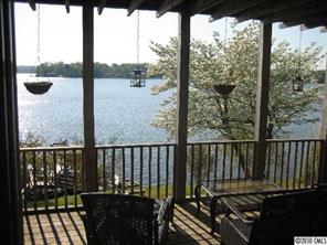 2069 Marquesas Avenue Tega Cay, SC 29708 - Photo 6 of 16 a view of a balcony with chairs and wooden floor