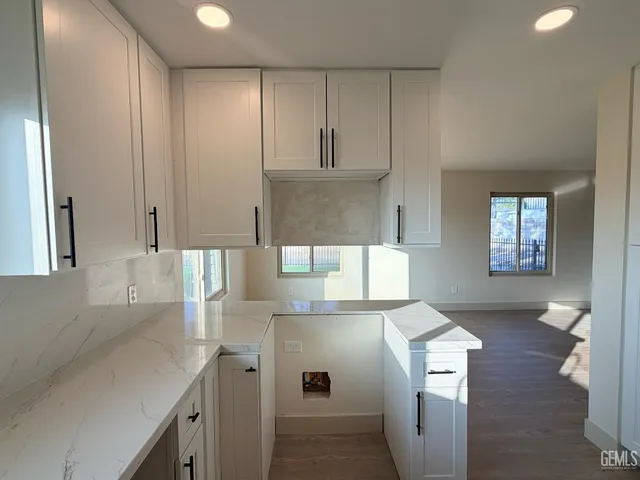 a bathroom with a sink a mirror and a shower