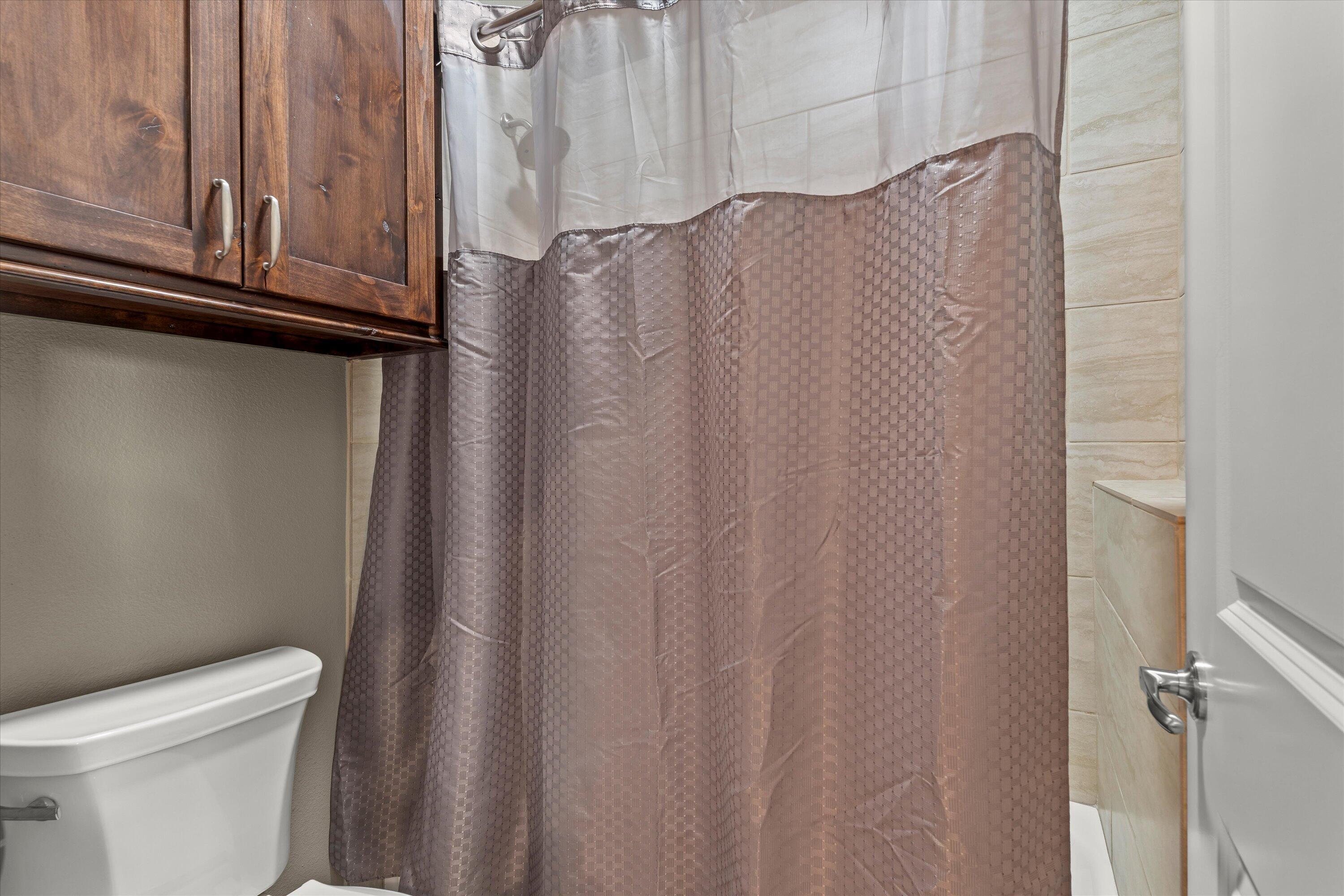 7033 101st Street Lubbock, TX 79424 - Photo 24 of 38 a bathroom with a sink and toilet