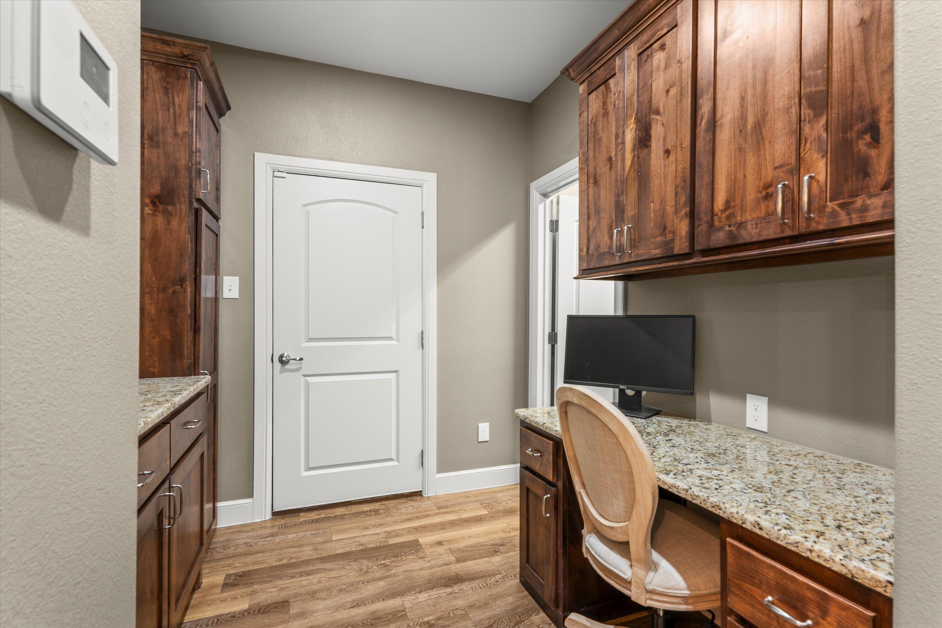 7033 101st Street Lubbock, TX 79424 - Photo 31 of 38 a view of a workspace with furniture