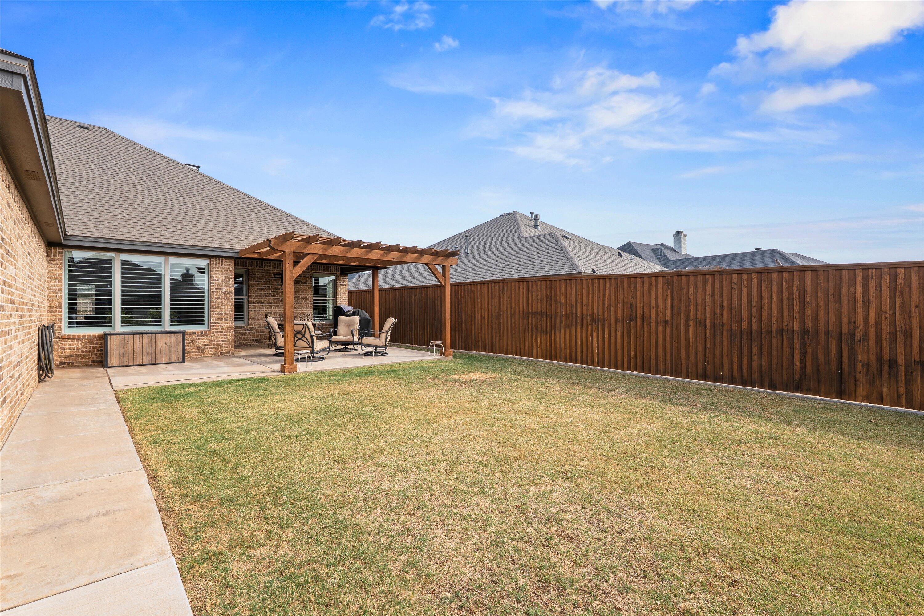 7033 101st Street Lubbock, TX 79424 - Photo 35 of 38 a swimming pool with wooden fence