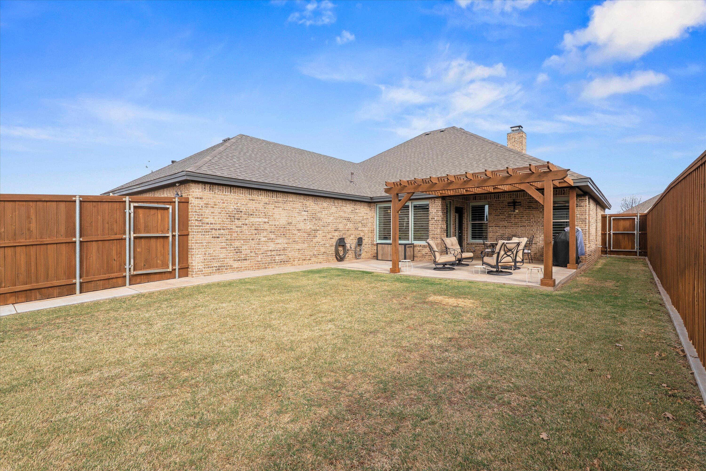 7033 101st Street Lubbock, TX 79424 - Photo 36 of 38 a front view of a house with garden