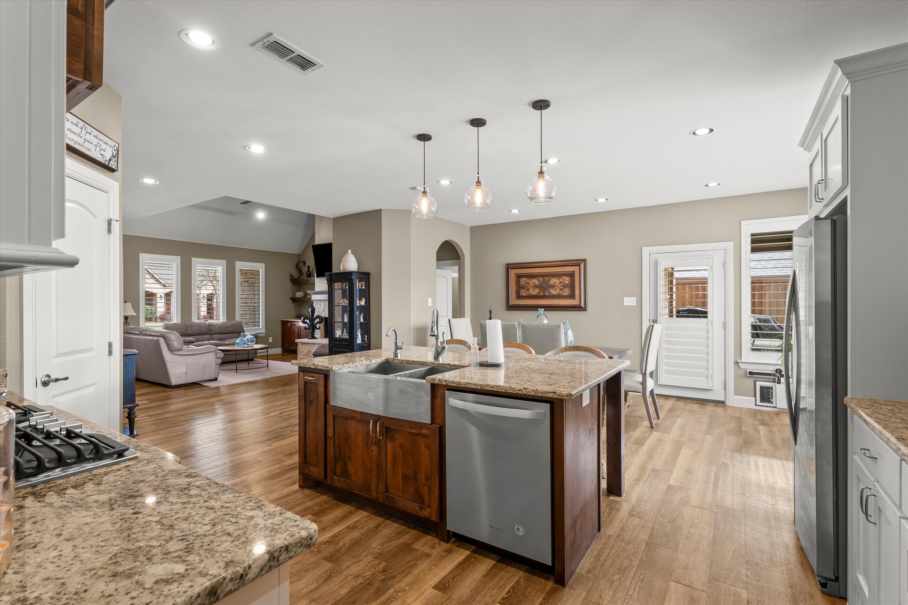 7033 101st Street Lubbock, TX 79424 - Photo 4 of 38 a view of a kitchen and dining room