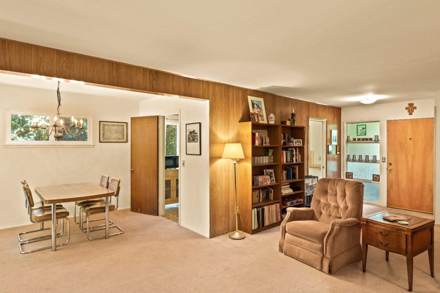3230 Rio Road Carmel, CA 93923 - Photo 5 of 21 a living room with furniture and a book shelf